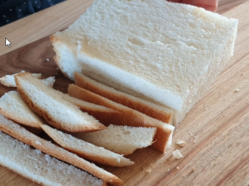 Removing crusts from sandwich bread for Korean corn dogs