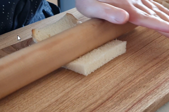 Flattening bread slices with rolling pin